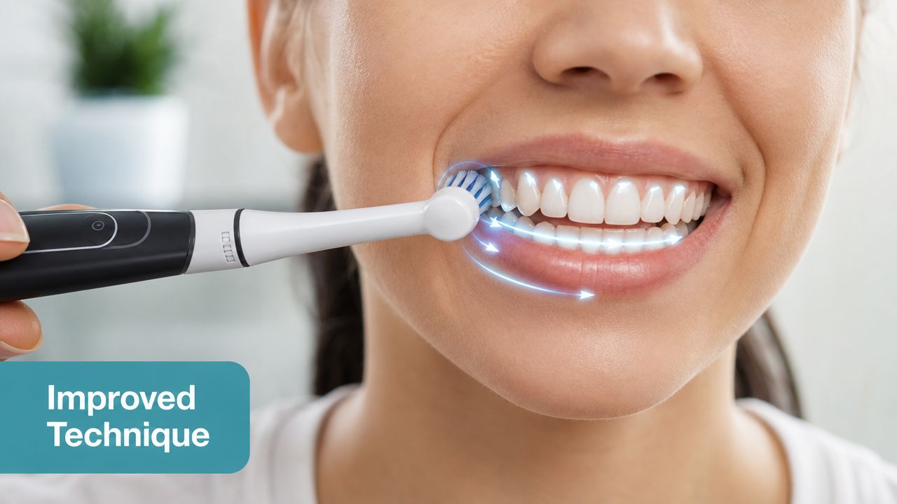 A close up view of a person using an electric toothbrush on their teeth with directional arrows.