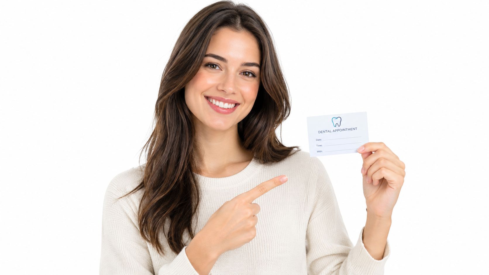 A smiling woman holding a dental appointment card and pointing at it with her finger.